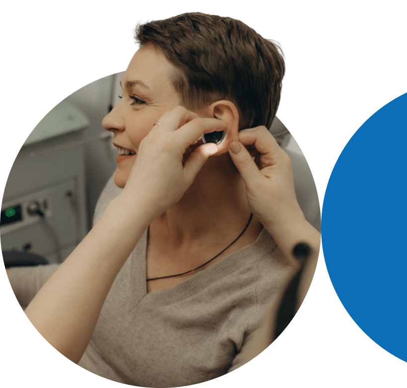 Patient receiving a hearing aid fitting